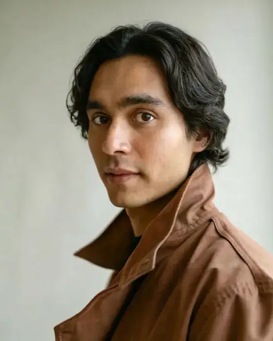 Person in everyday wear before professional outfit swap